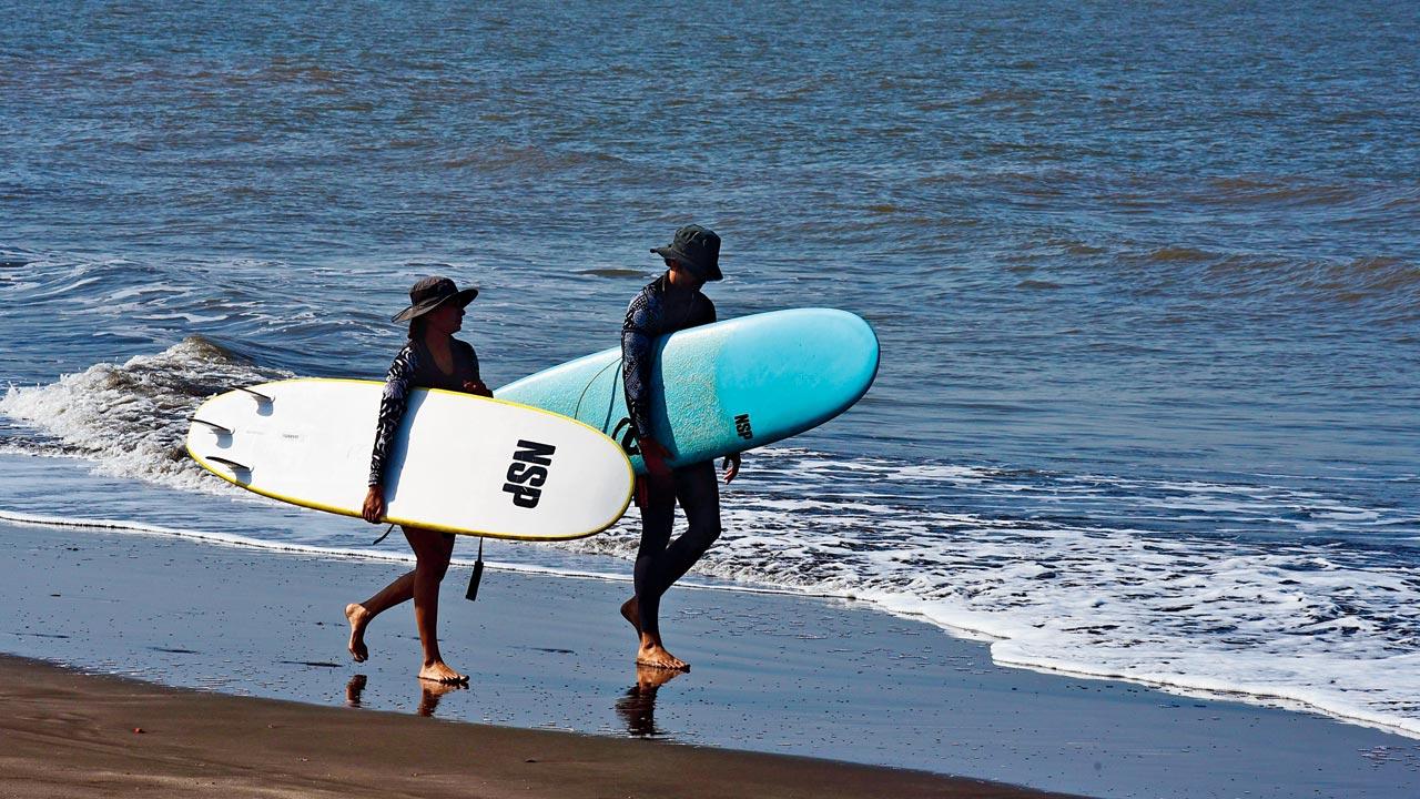 Surfers at Mumbai Surf School at the Rajodi Beach, a mere eight km from Virar railway station have become addicted to the sun, sand and surfboard. Pics/Nimesh Dave