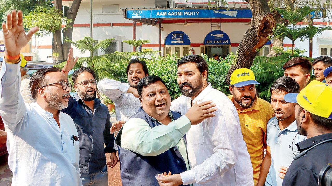 AAP workers celebrating. Pic/PTI