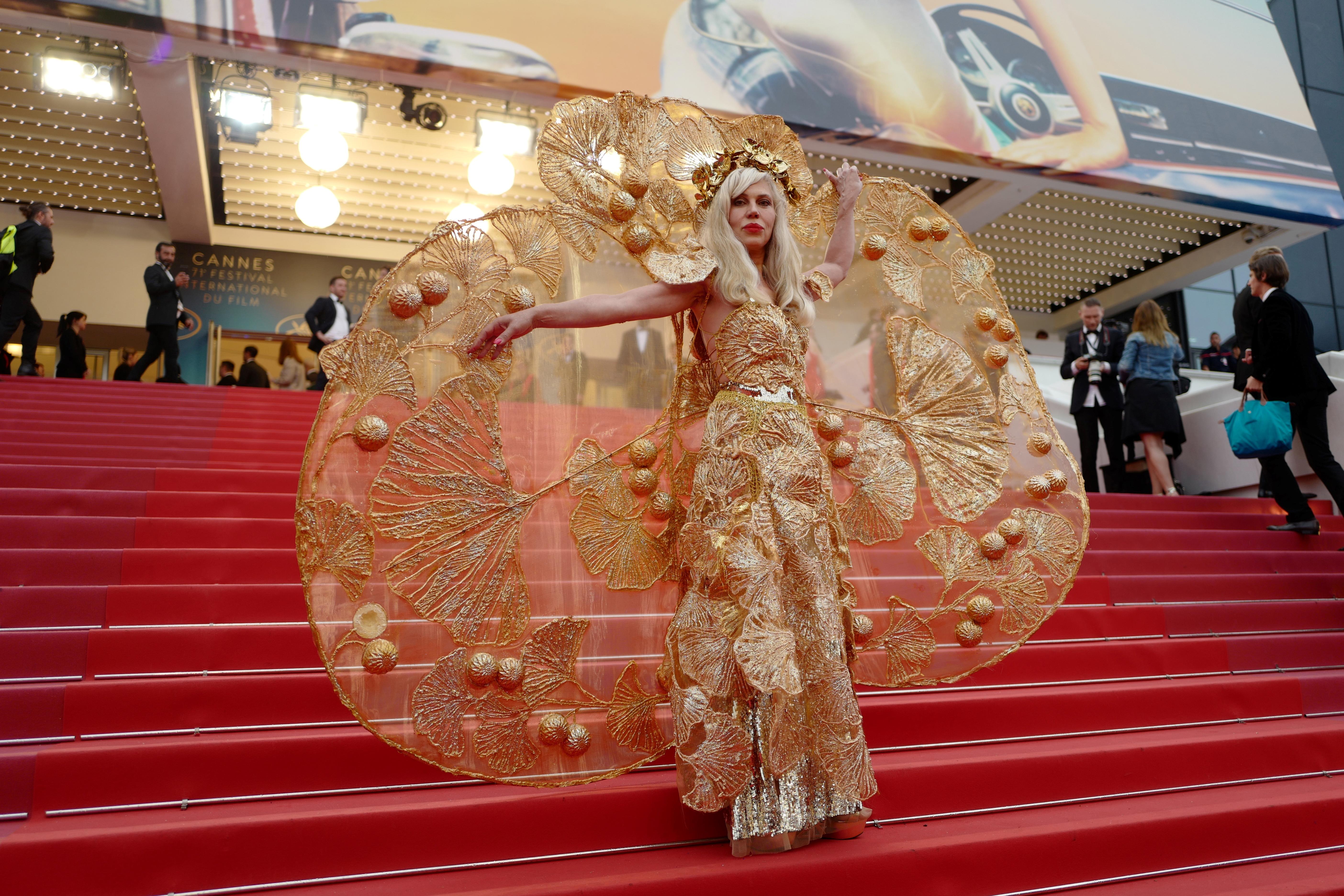 A guest poses as she arrives on May 16, 2018 for the screening of the film 