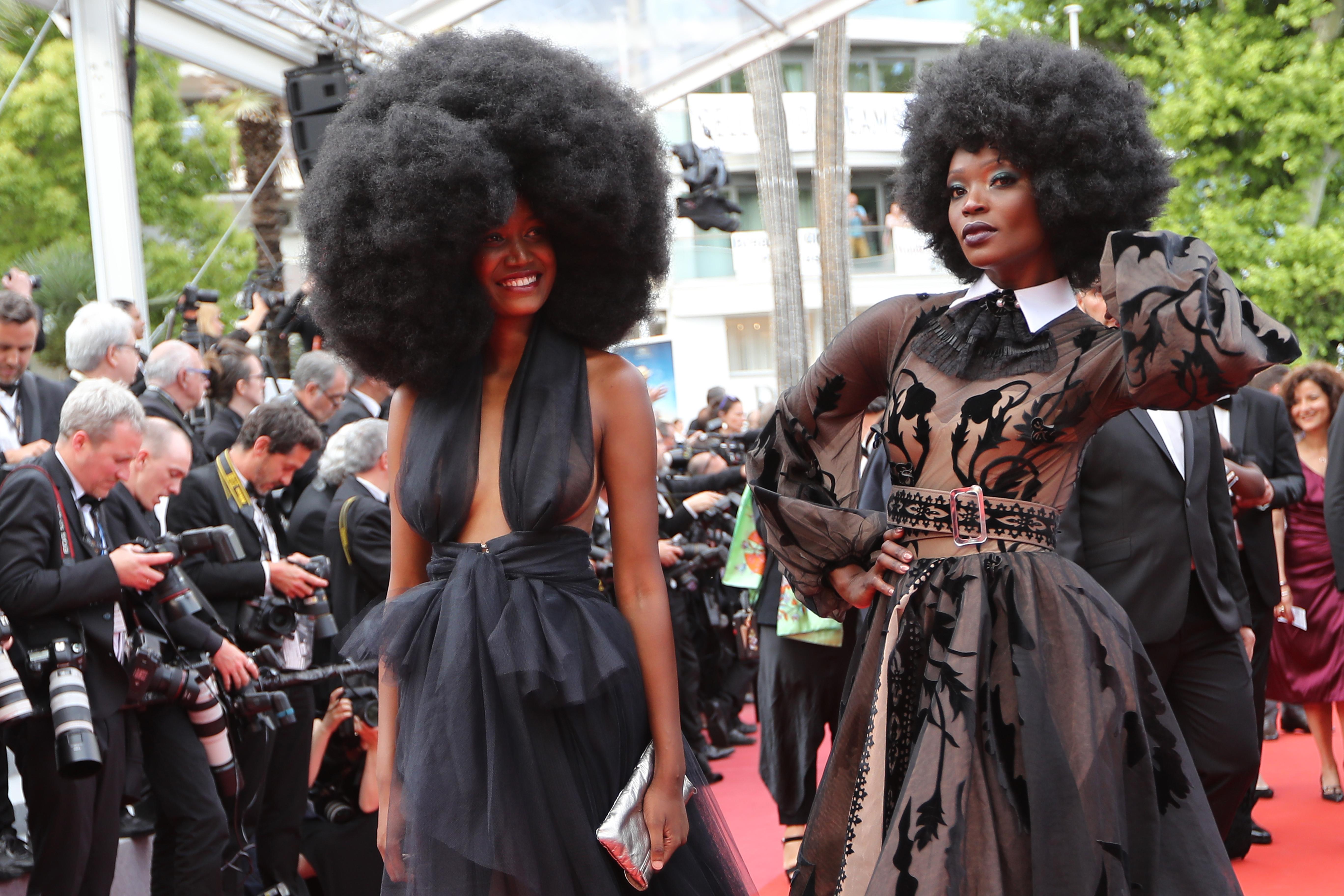 Tanzanian model Miriam Odemba (R) and model Mariame Sakanoko arrive on May 18, 2018 for the screening of the film 