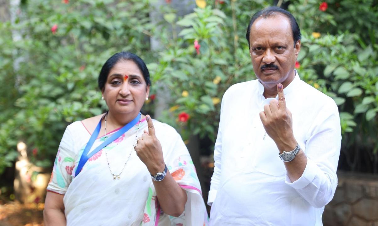 Ajit Pawar, NCP candidate Sunetra Pawar cast vote in Baramati during LS polls