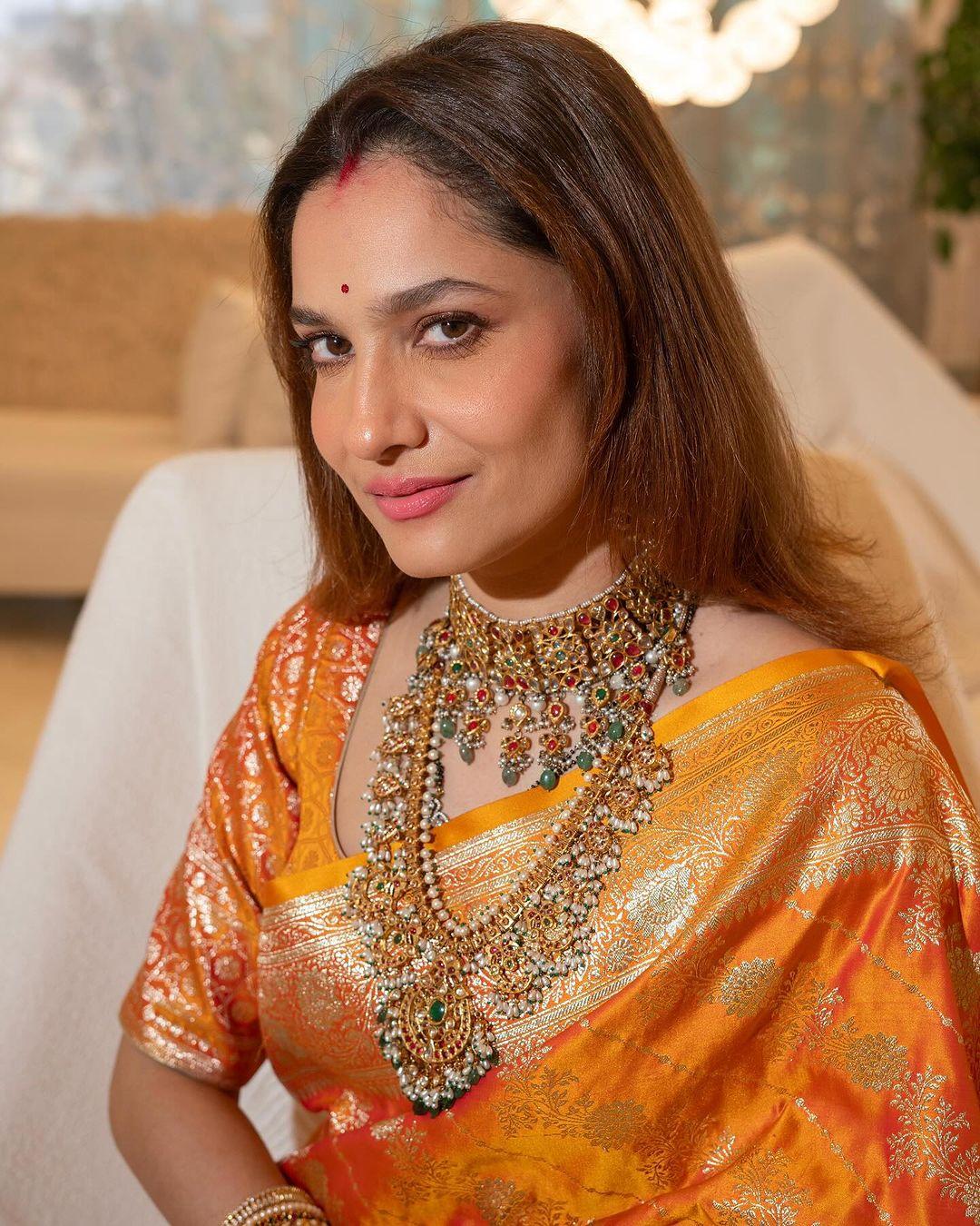 By leaving her hair open and putting on minimal makeup, Ankita let her natural beauty shine. Ankita wore heavy jewellery and multiple matching bangles to finish her look