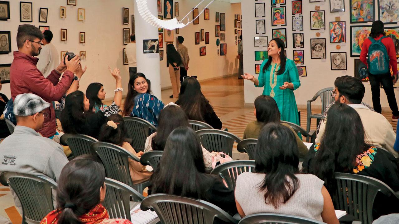 Participants discuss art at a session