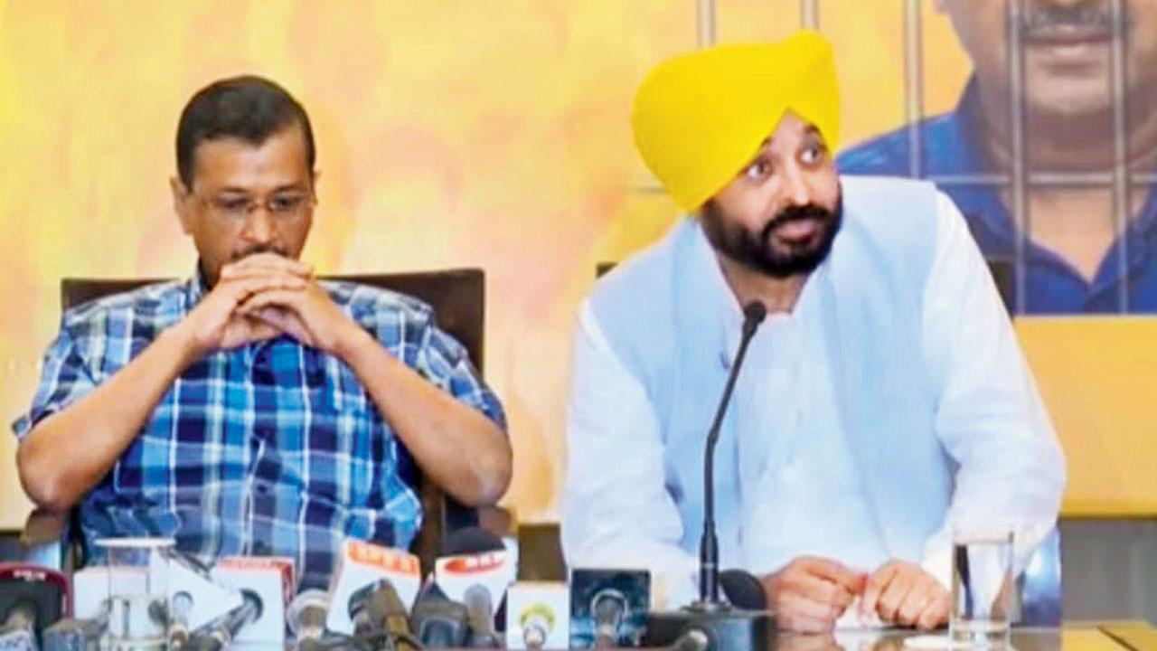 AAP National Convenor Arvind Kejriwal and Punjab Chief Minister Bhagwant Mann at the press conference on Monday