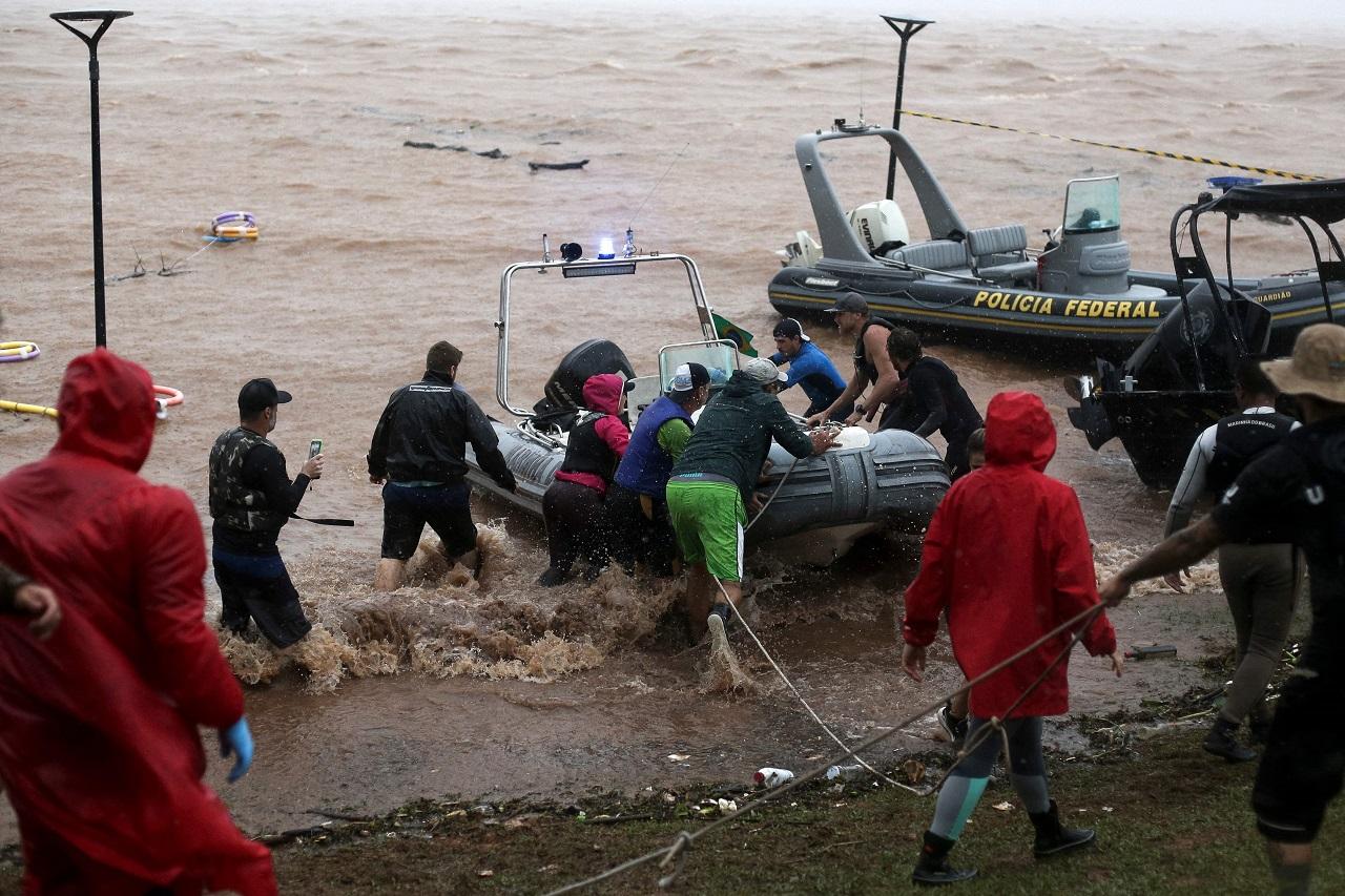 Staffers of the state's civil defense agency told The Associated Press they have been struggling to persuade residents of the city of Eldorado do Sul, one of the hardest hit by the floods, to leave their homes. It is located beside Porto Alegre, near the center of the state's coastline. At least four people declined to evacuate