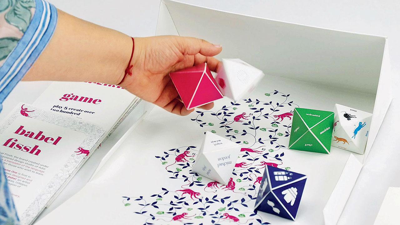 The octahedral dice are thrown to reveal prompts for the logo designers