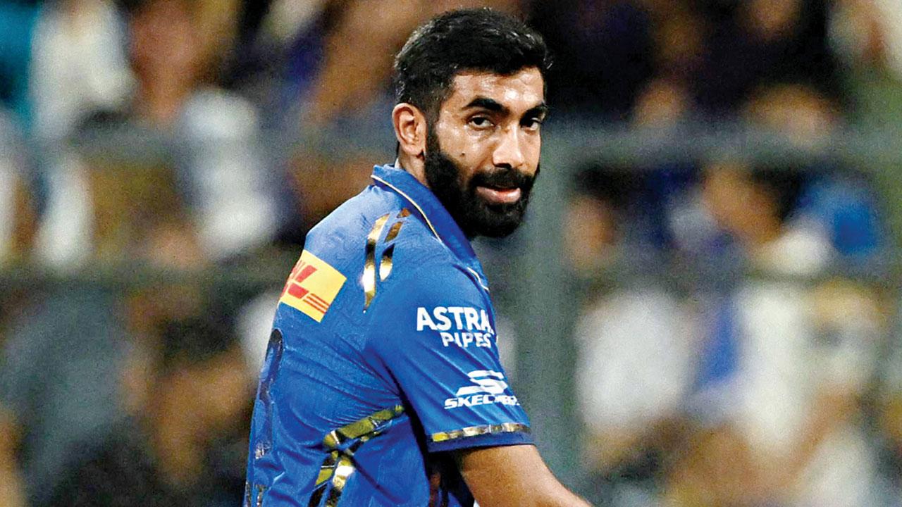 MI’s Jasprit Bumrah after taking the wicket of KKR’s Mitchell Starc at the Wankhede Stadium on Friday. Pic/AFP