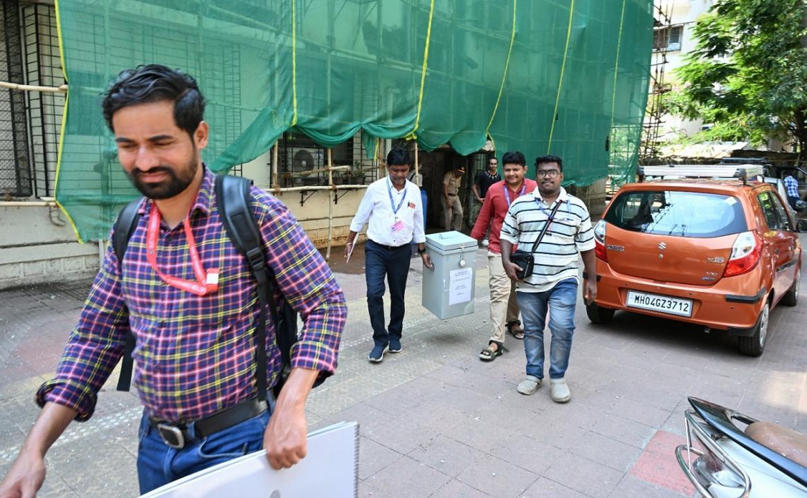 In Photos: EC officials conduct home voting for senior citizens in Mahim area