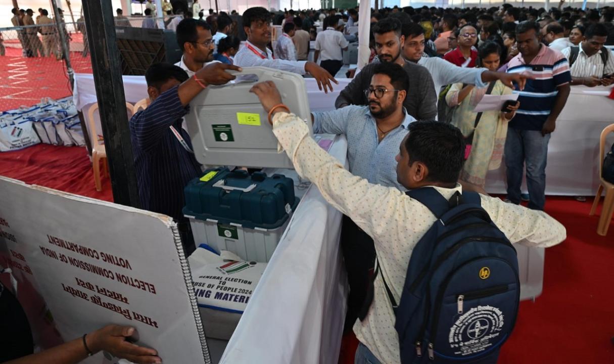 Officials carry EVMs from distribution centre in Mumbai ahead of LS polls