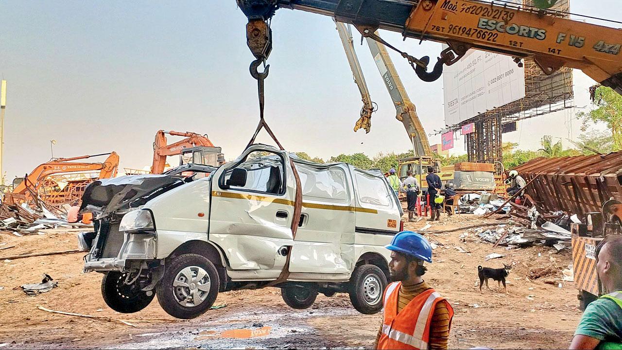 A vehicle that was removed from beneath the billboard’s metal frame. Pic/Rajesh Gupta