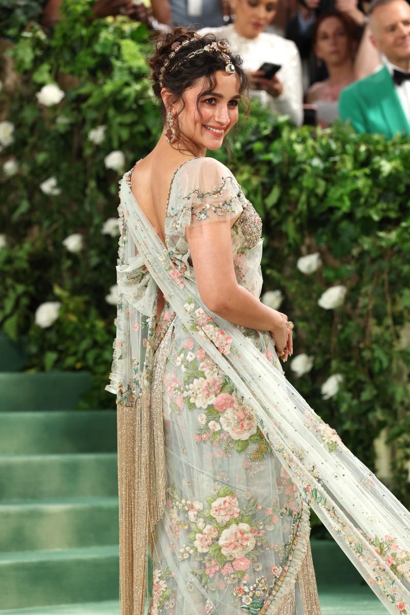 This custom look took 1965 hours to craft. The green saree itself is stunning, but the long pallu with a train adds an extra wow factor.