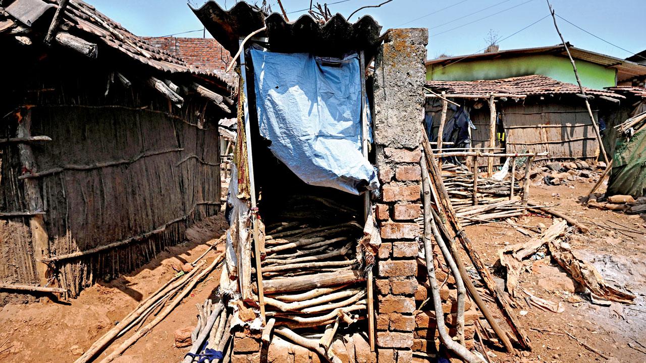 A half-constructed toilet outside the houses under the Swachh Bharat Mission is without water, commode, and electricity. Villagers use it to stock firewood