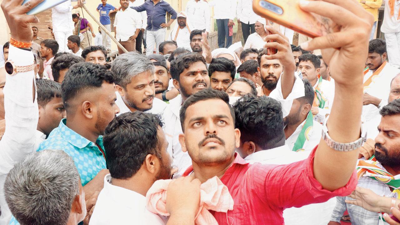 Pawar’s supporters try to take selfies with him. Pic/Anurag Ahire