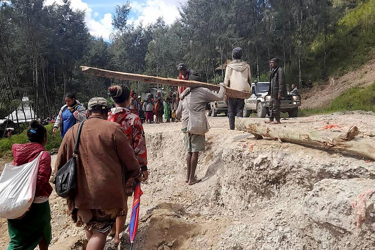 Emergency responders say that up to 8,000 people might need to be evacuated as the mass of boulders, earth and splintered trees that crushed the village of Yambali in the South Pacific island nation's mountainous interior on Friday becomes increasingly unstable