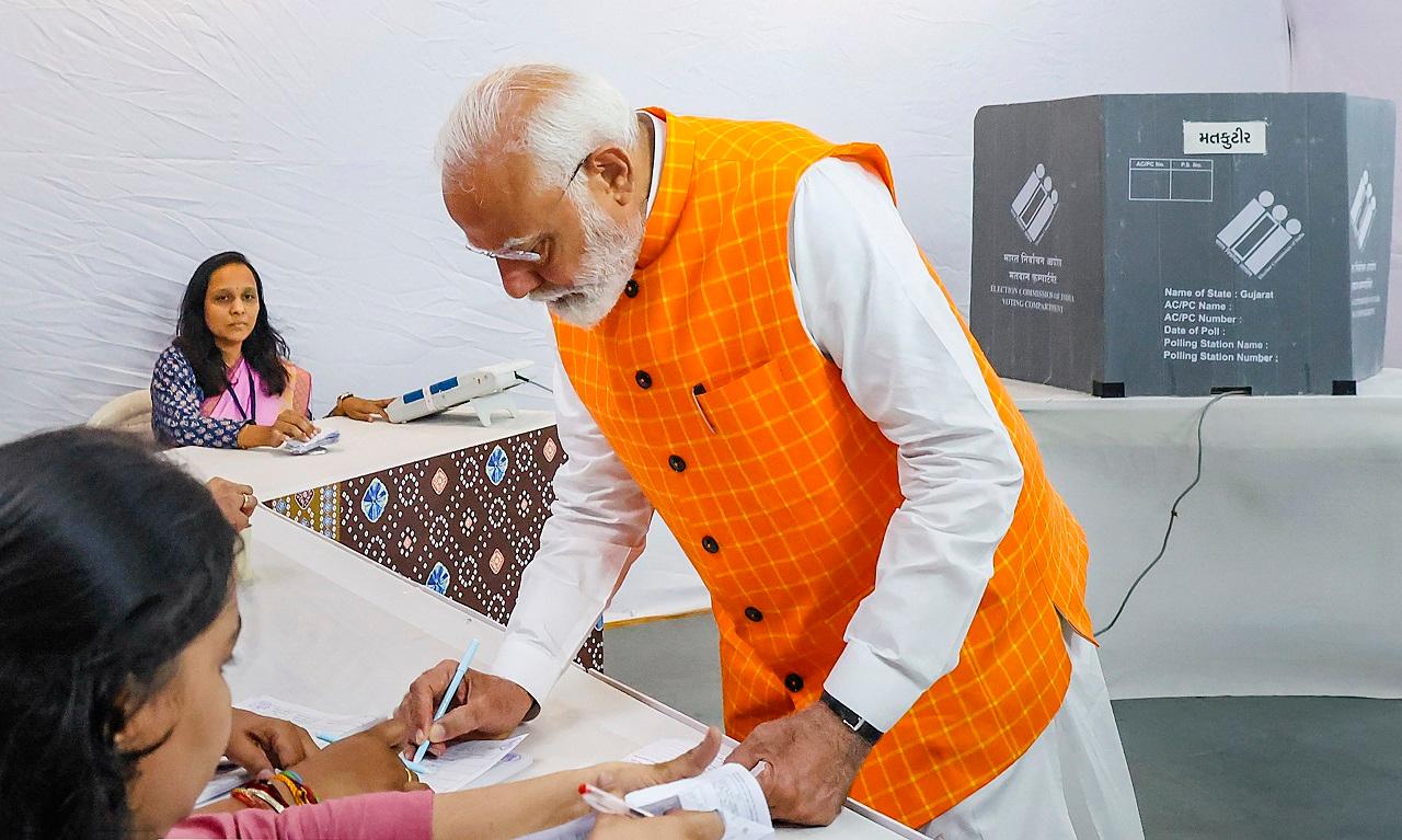 PM Modi reached the polling booth at Nishan Public School in Ranip locality of Ahmedabad city soon after the polling began at 7 am and cast his vote
