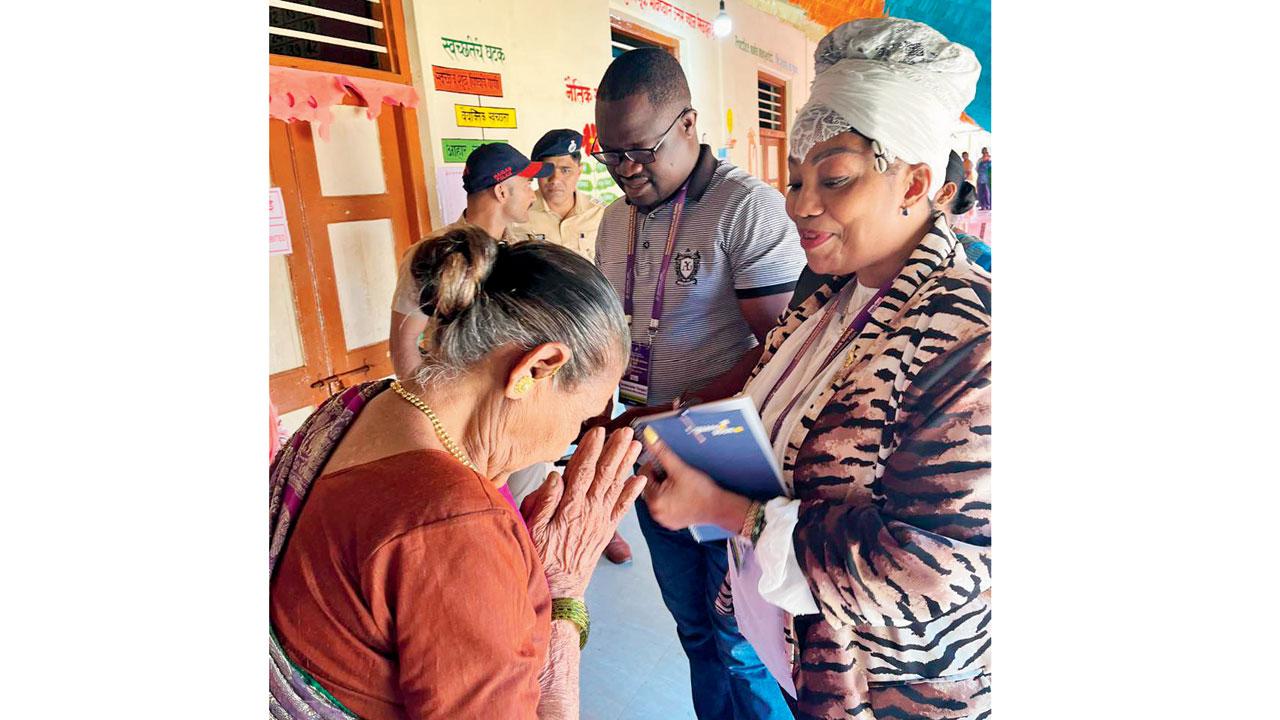 The foreign delegates from Zimbabave being greeted by an elderly voter