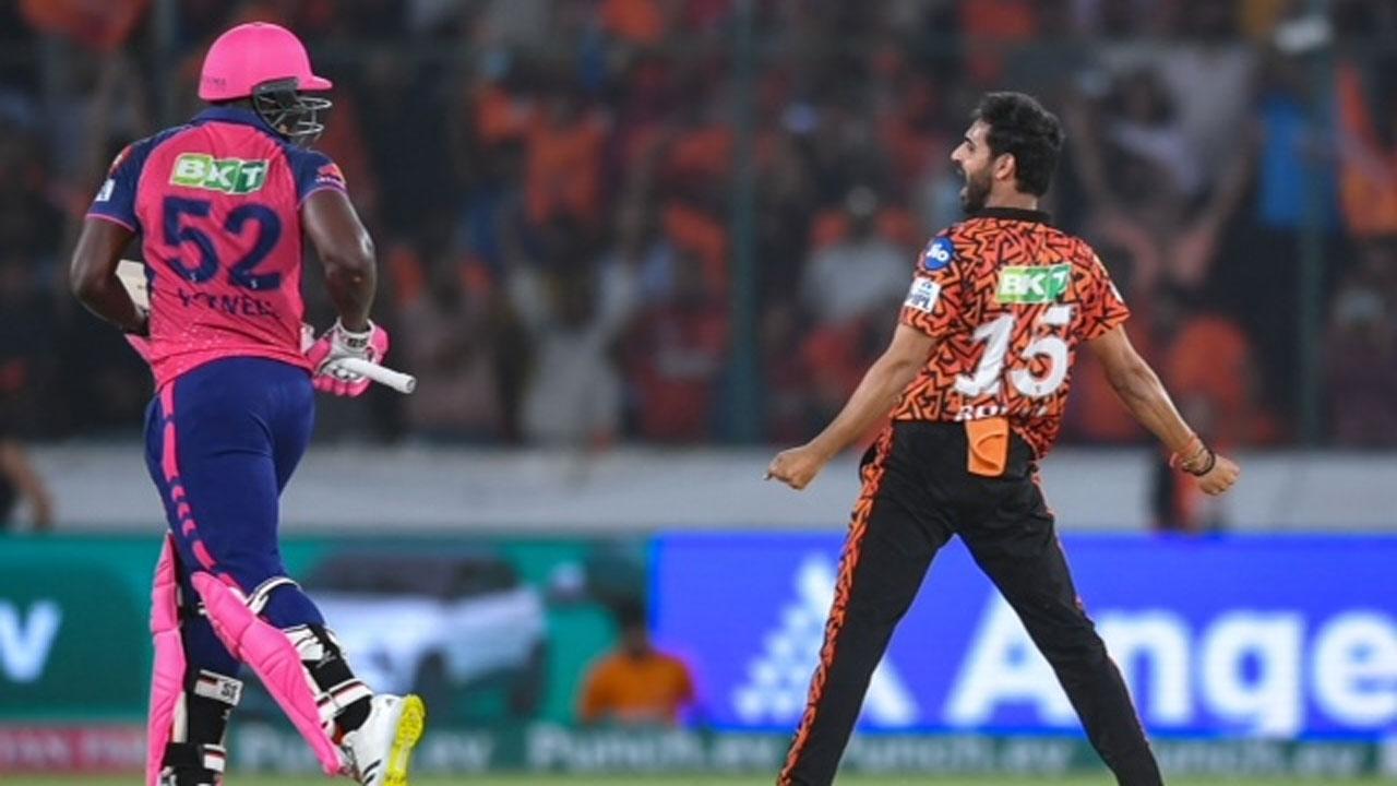 SRH pacer Bhuvneshwar Kumar celebrates the wicket of RR’s Rovman Powell off the last ball. PIC/AFP 