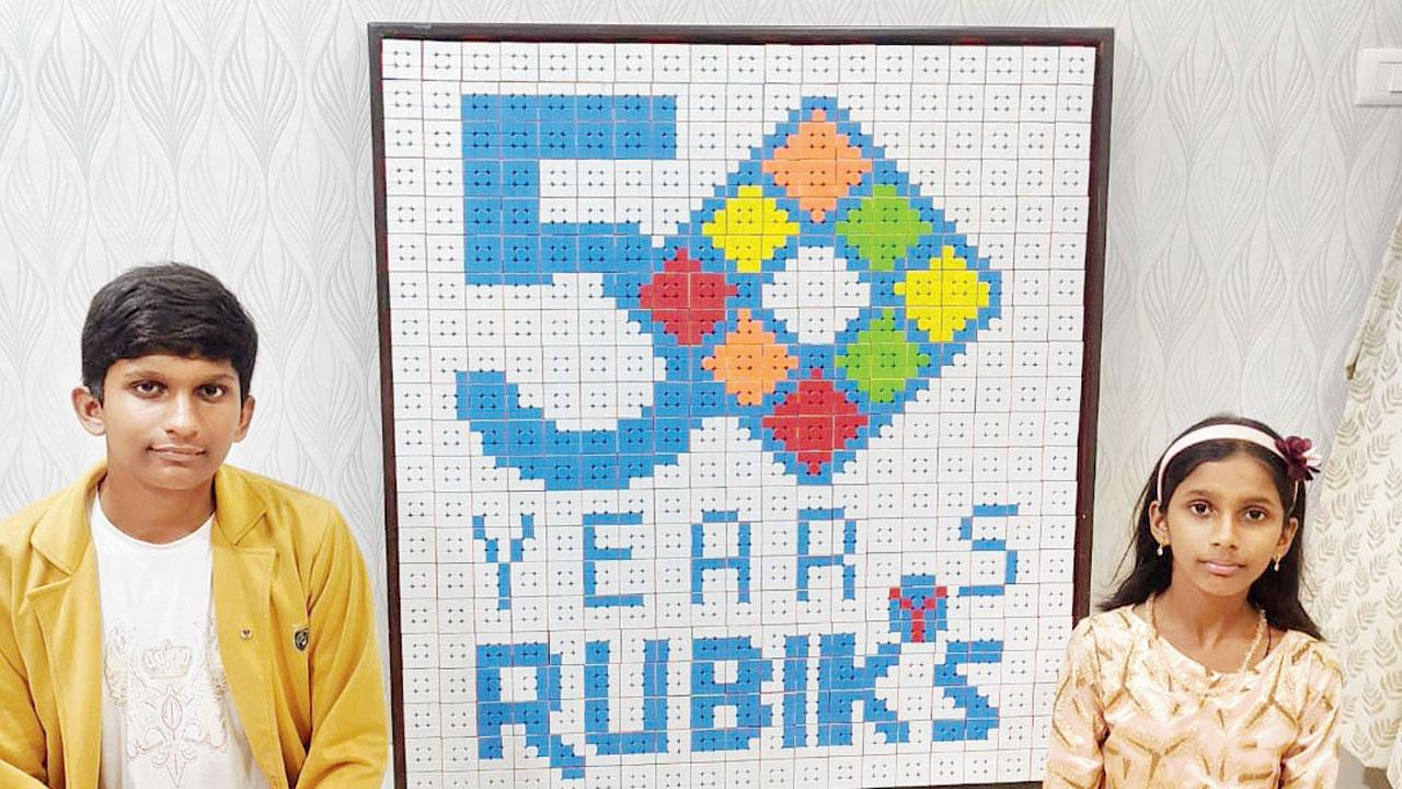 Ethan and Annie Singh with the artwork 
