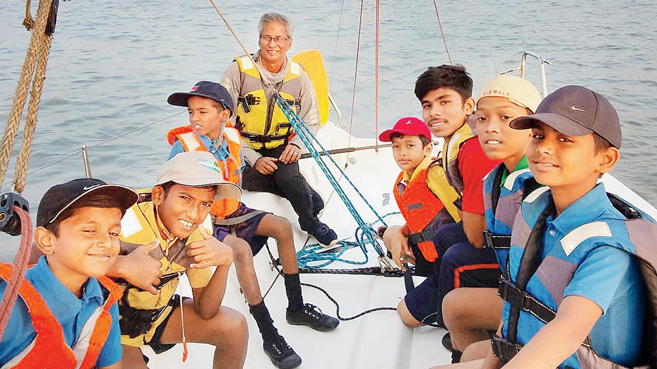 School-going children learn to sail at sea