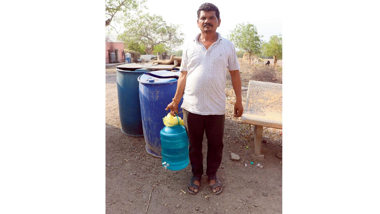 Khandu Borgaonkar carrying drinking water