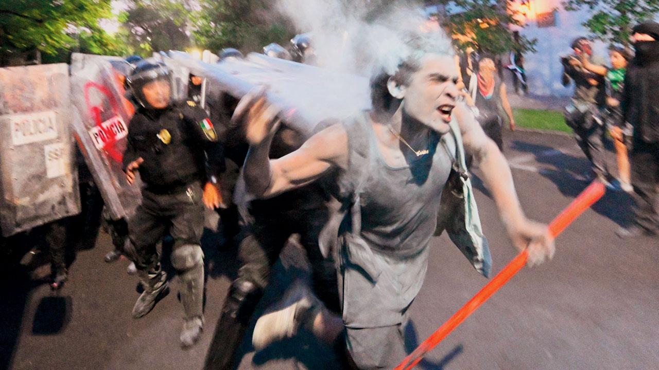 Demonstrators clash with the police in front of the Israeli embassy in Mexico City. Pics/AFP