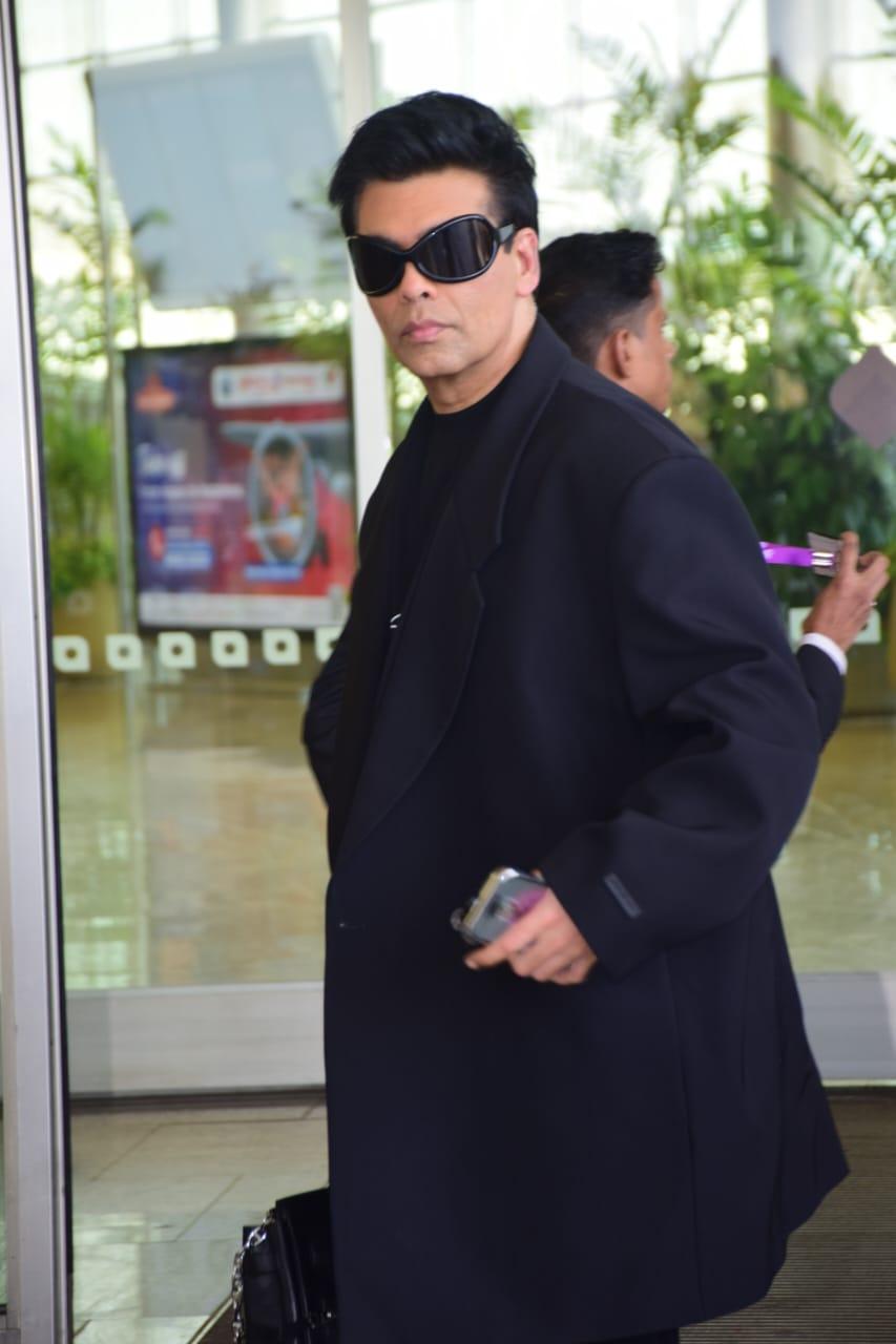 Karan Johar was clicked wearing an all-black outfit as he jetted off from the city