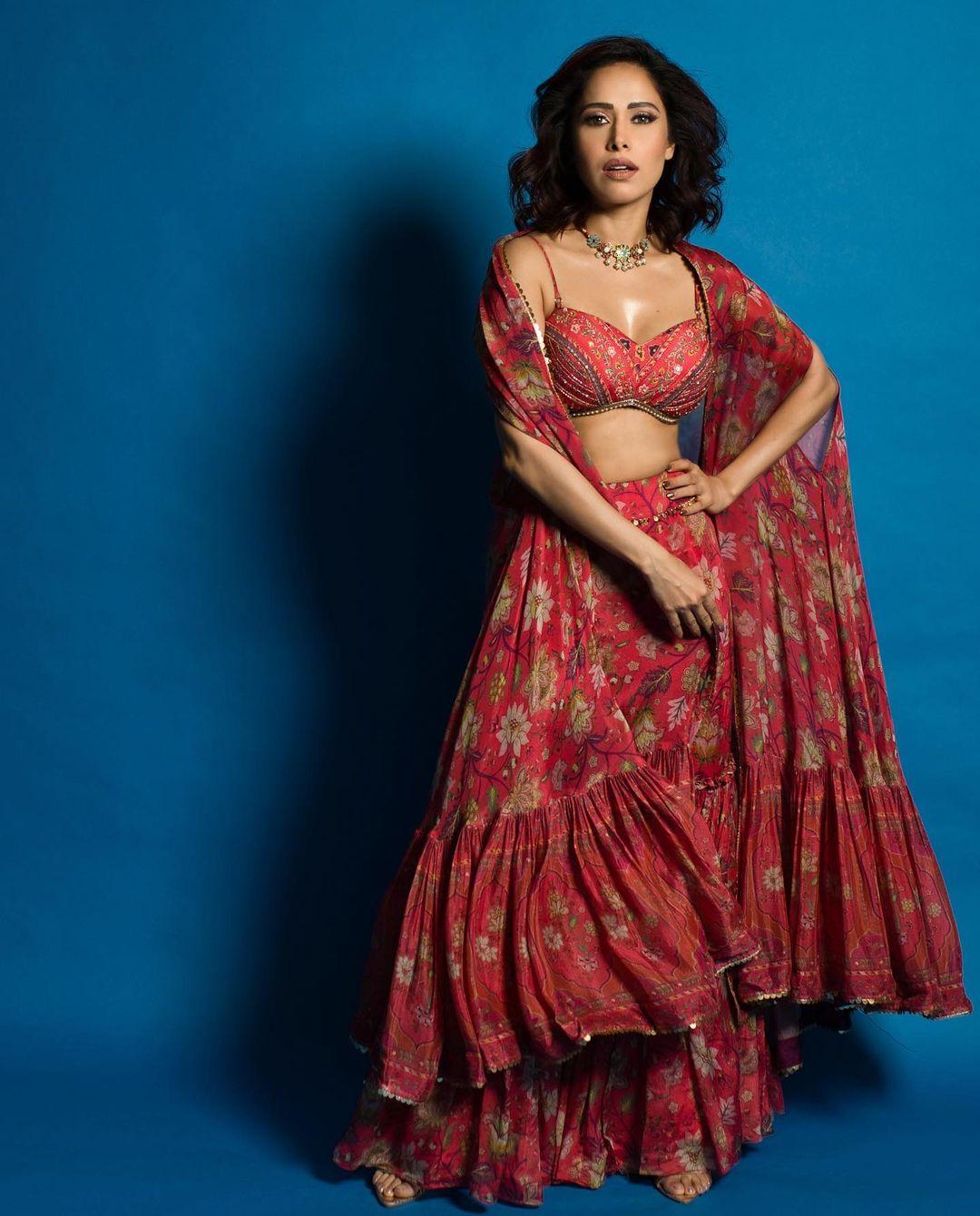 In this look, Nushrratt wore a beautiful red lehenga paired with a strappy blouse, which is perfect to beat the heat