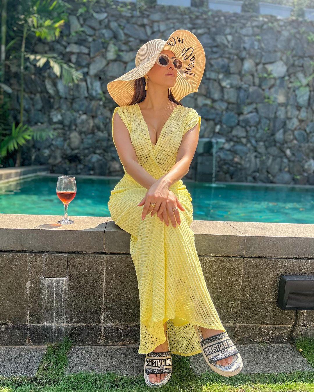Get inspiration from Nushrratt's yellow gown and slay it like a queen. The actress paired her gorgeous gown with a stylish hat, and we can't take our eyes off her