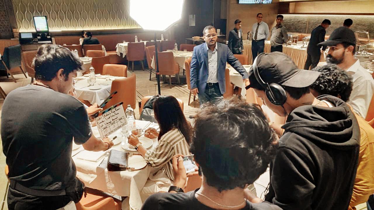 Pawar (in a blue suit) with the team during the shoot of the film