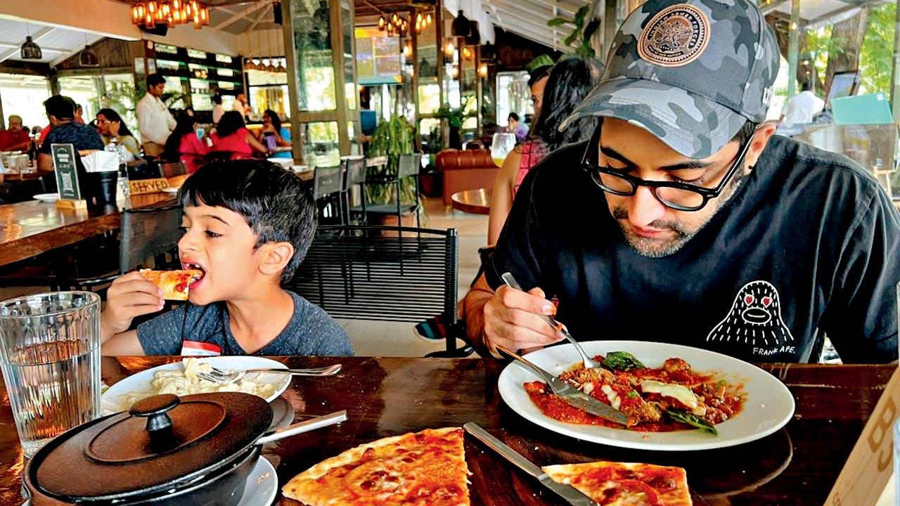 Akshay Oberoi tucks into a continental meal with his son Avyaan