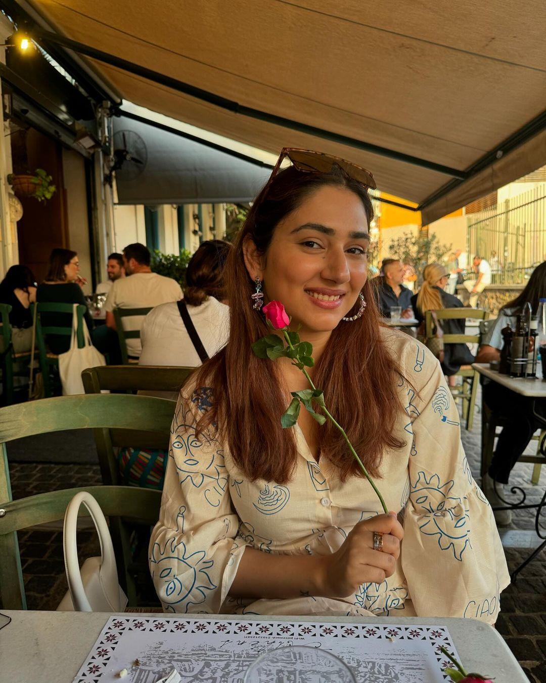 This cute picture has Disha posing with a cute red rose, and it makes our hearts smile