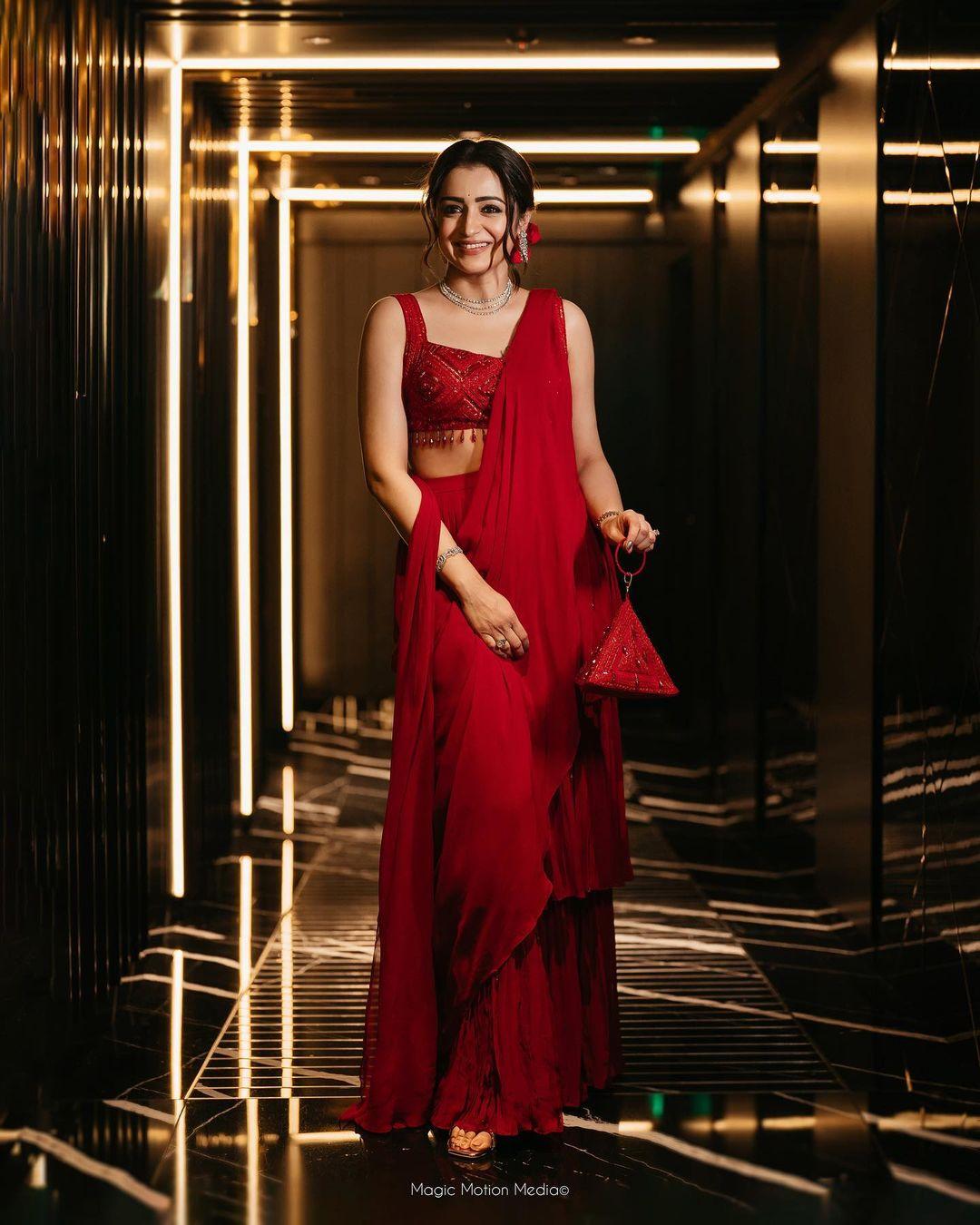 Red is the perfect colour when it comes to traditional outfits, and this ready-to-wear saree from Trisha’s closet is a great pick