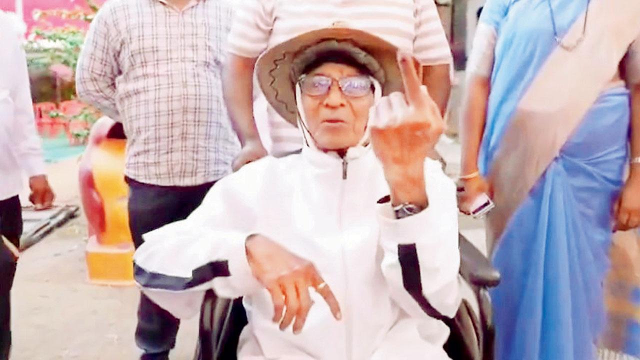Gopal Waman Limaye, 93, outside the JRH Kanyashala voting centre at Alibaug