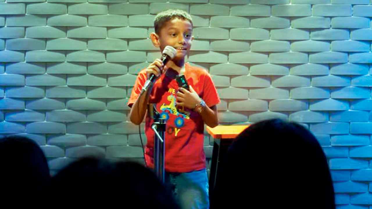 A young rapper shares his poem at the venue