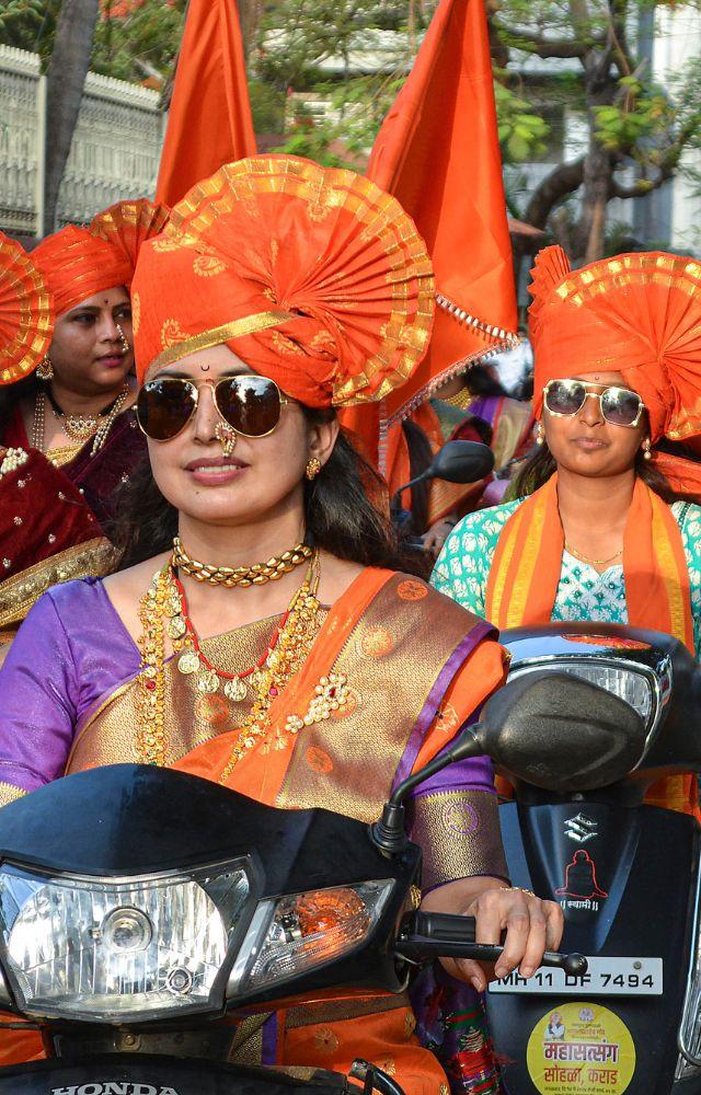 Women during a bike rally on the eve of the Akshaya Tritiya festival, in Karad, Thursday, May 9, 2024
