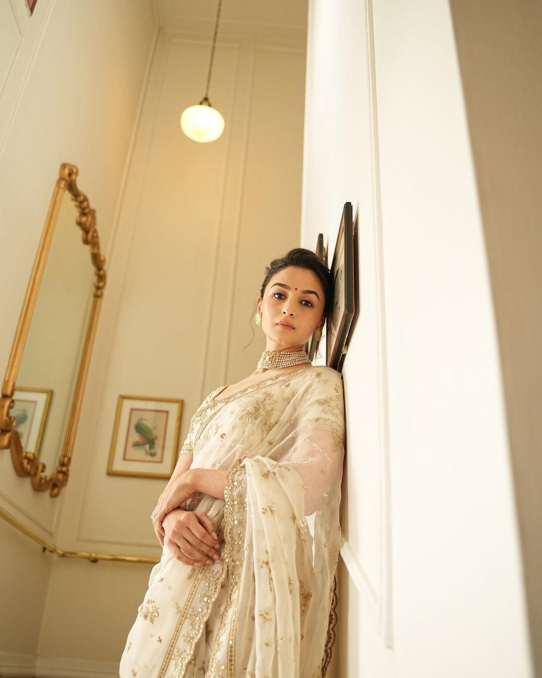 Alia complemented her look with a pearl necklace and earrings, and she pulled off the classic bun hairstyle with elegance