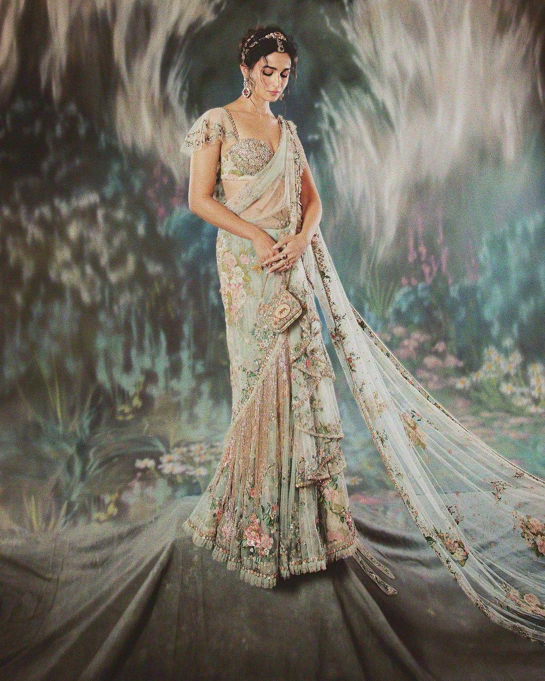 The beautiful mint green saree was crafted by a team of 163 artisans in India, who spent around 1,965 hours working on it over several months