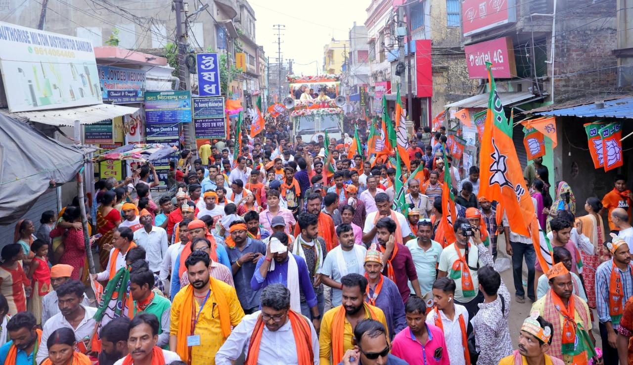 BJP workers and supporters were seen walking along the roadshow with flags and posters of BJP