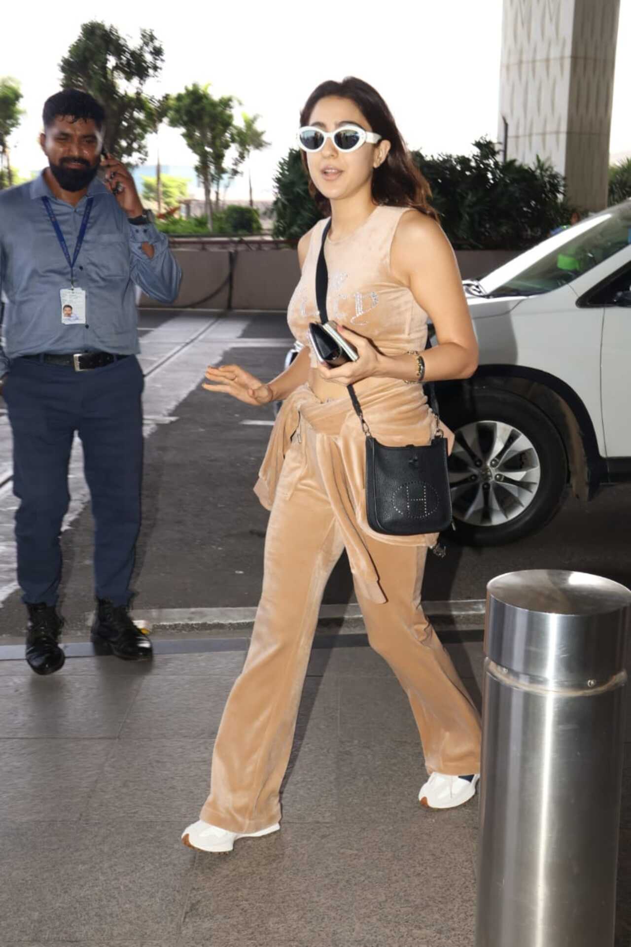 Sara Ali Khan kept it casual in a nude velvet tracksuit with funky sunglasses amping up her airport look. 