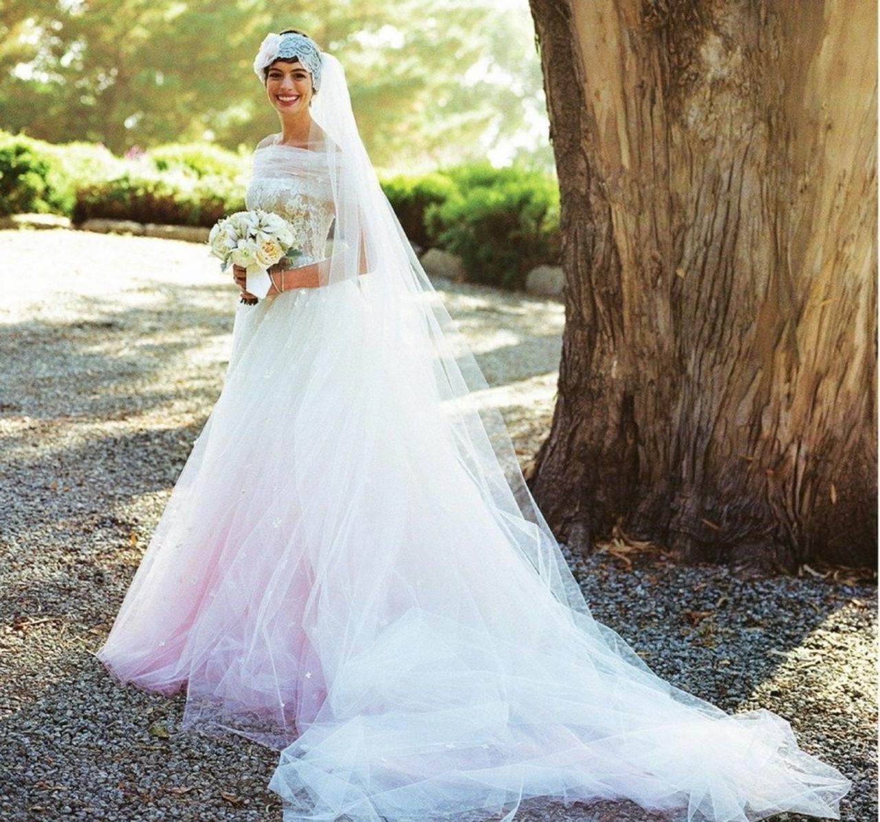 Anne Hathaway married Adam Shulman wearing a custom-made Valentino gown for their big day in Big Sur, California. It was an off-the-shoulder dress with intricate lace and embroidery paired with a full-length veil and headpiece that exuded vintage vibes. 