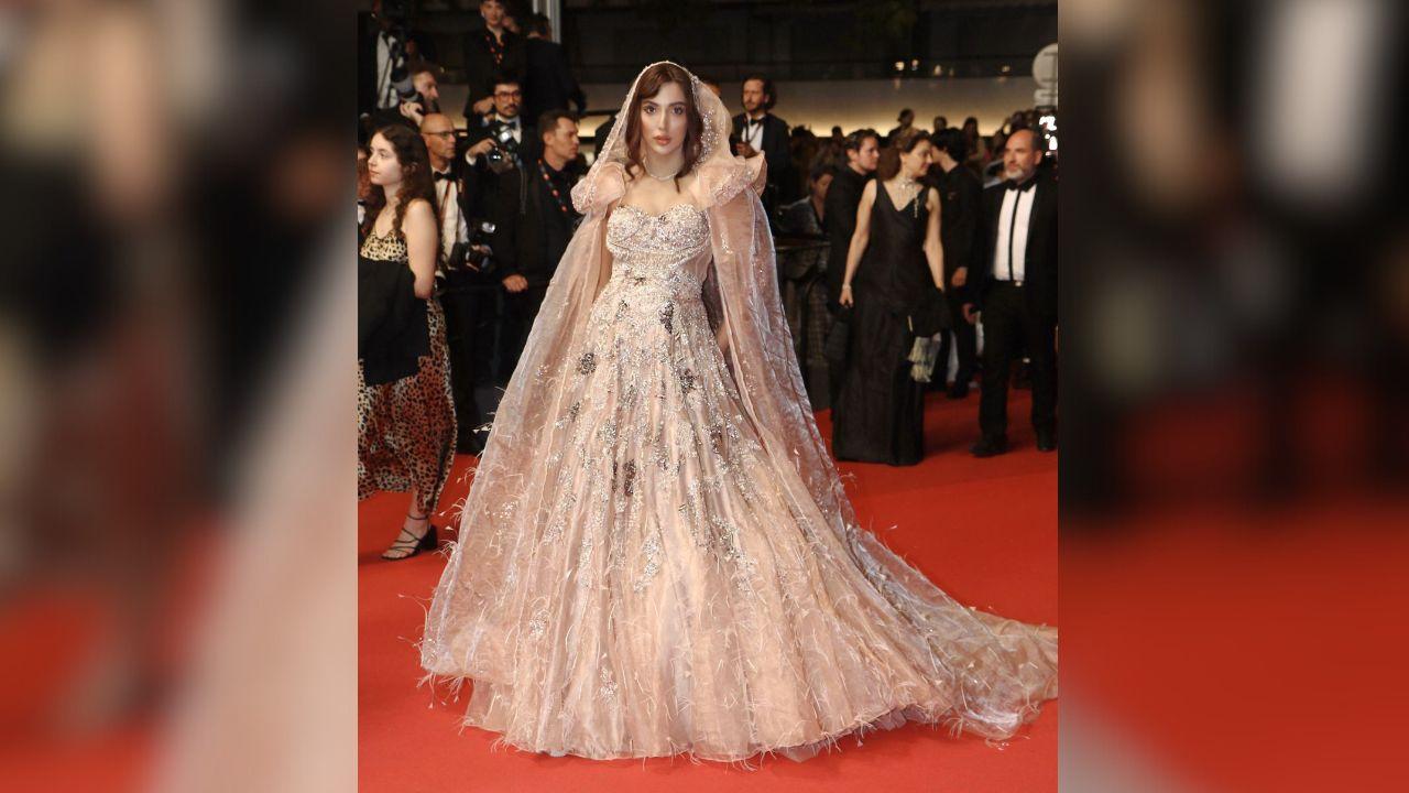 Arissa Khan made a striking appearance in an elaborately designed gown by Dolly J. In a trailblazing move, Arissa wore a ‘Ghunghat’ on a Western outfit at Cannes, a poignant gesture that paid homage to her roots and showcased the rich cultural tapestry of India. This innovative fusion was a proud representation of her identity as a modern Indian woman deeply connected to her heritage.