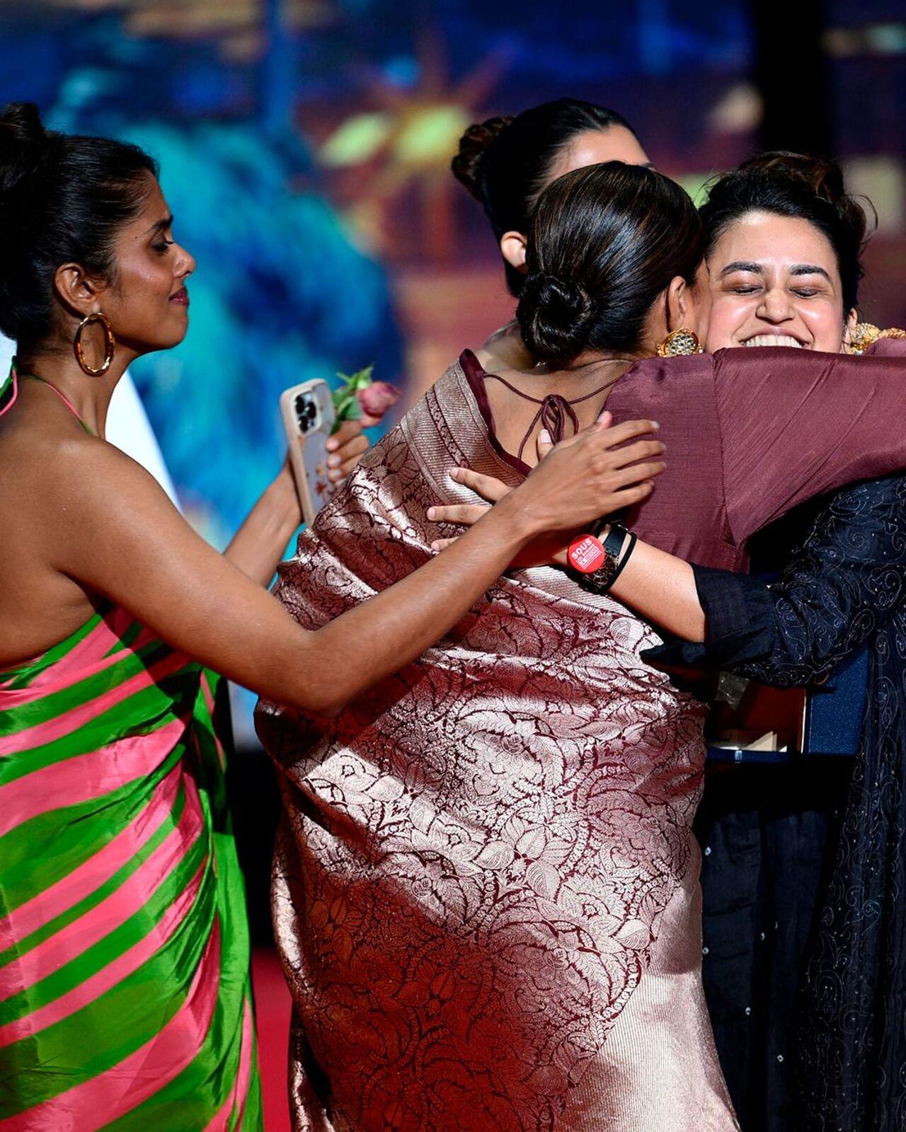 The women who had danced their way to the screening of their film on the red carpet on Thursday hugged and celebrated their moment on stage