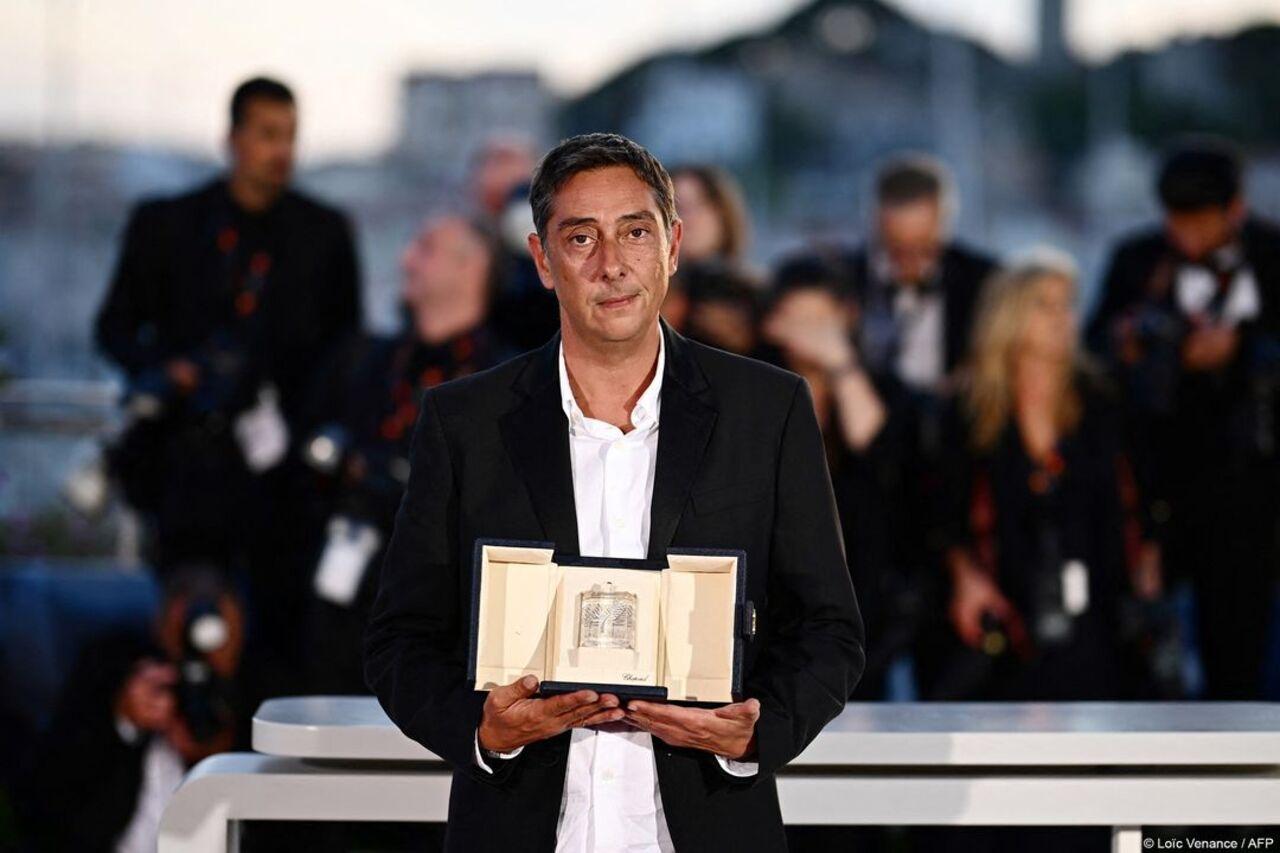 Portuguese director Miguel Gomes poses during a photocall after he won the Best Director prize for the film 