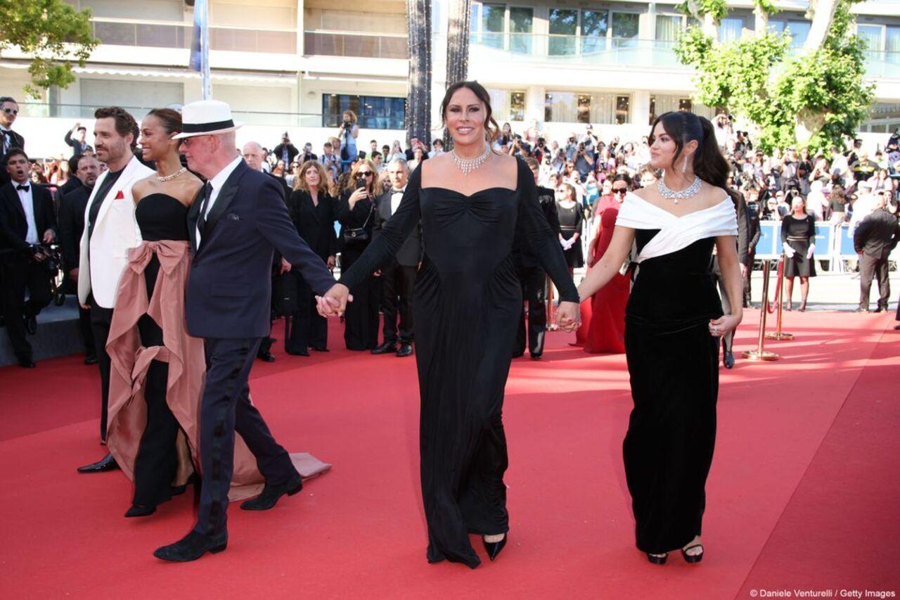 Selena Gomez walks the red carpet hand-in-hand with the team of Emilia Perez