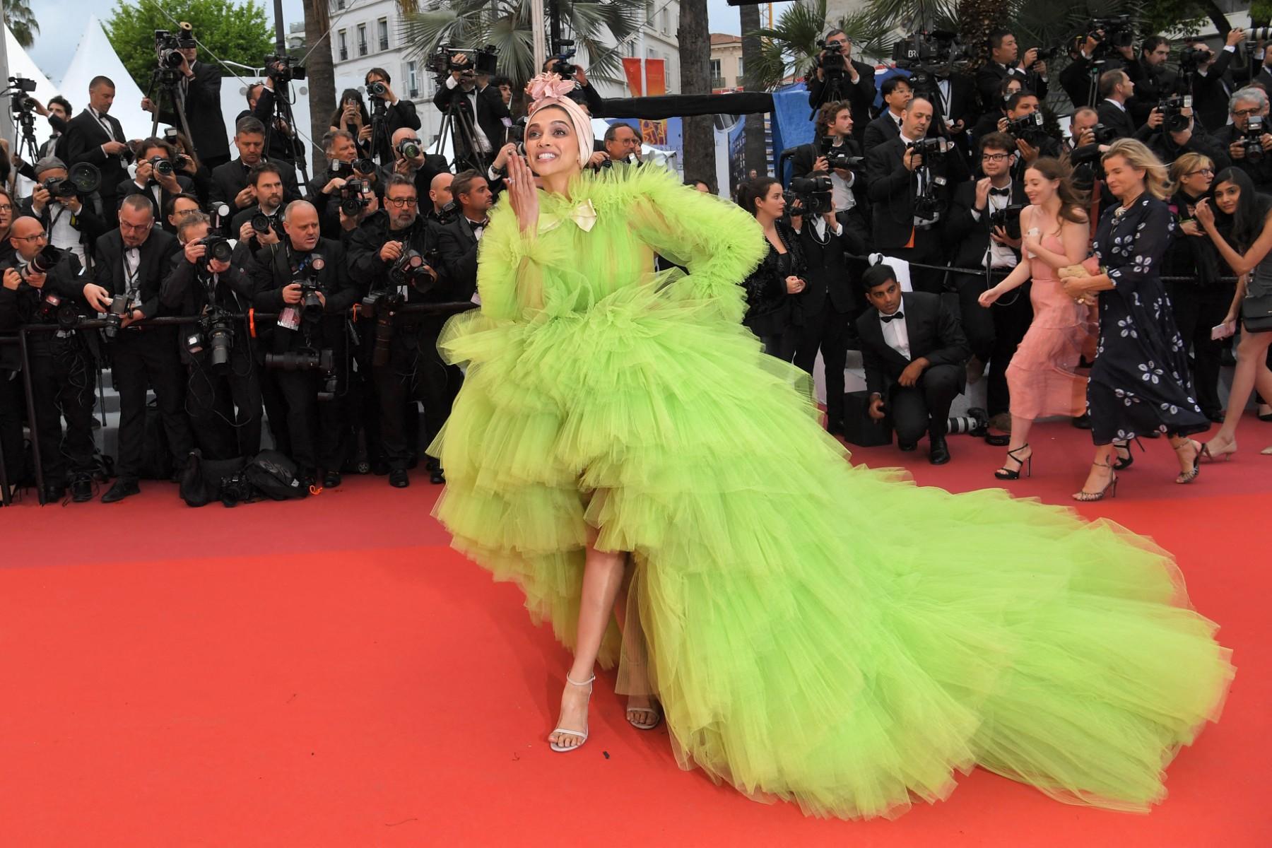 For her red carpet appearance at the 72nd Cannes Film Festival, Deepika Padukone opted for the trendy neon green color. She wore a voluminous tulle gown designed by Giambattista Valli, complemented with delicate blush bows and a matching turban.