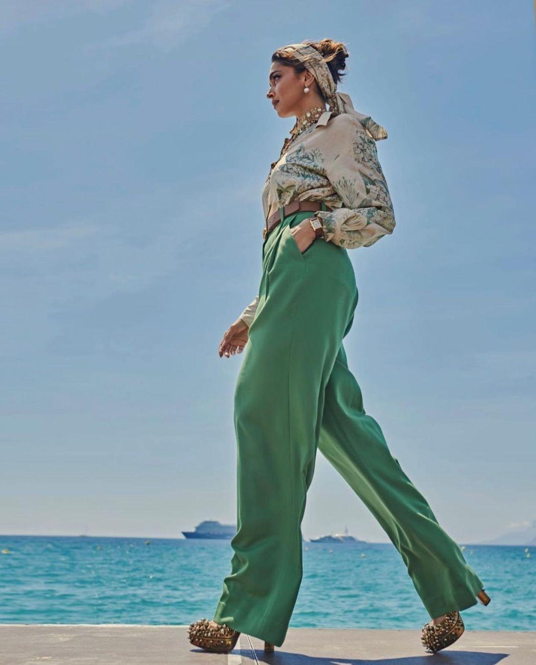 Deepika Padukone wore a Mysore silk shirt with a beige base, featuring a digital print of hand-painted vintage floral motifs inspired by Company paintings from the Sabyasachi Art Foundation.