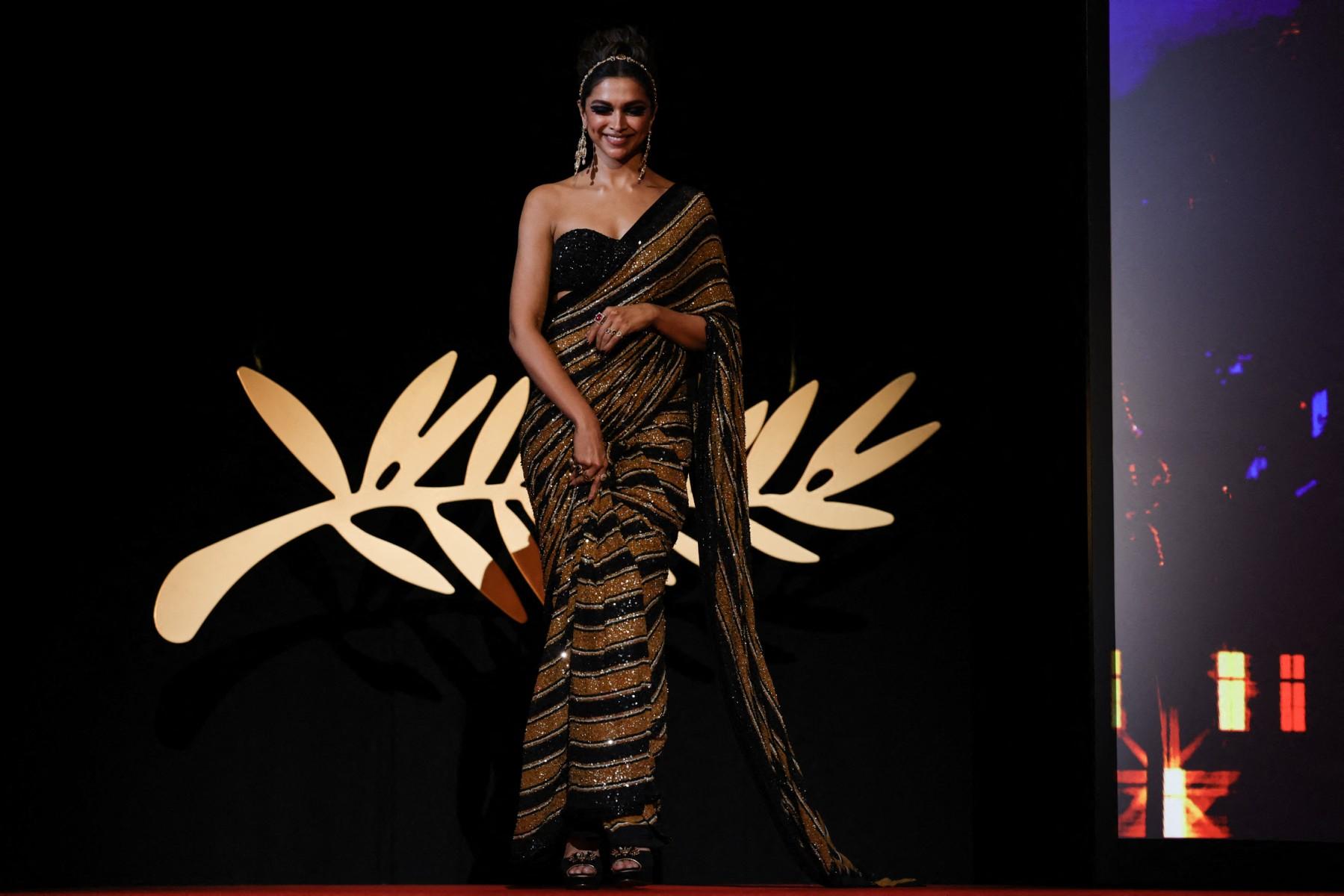 At Cannes, Deepika Padukone wore a mustard and black sequin-embellished saree. The strapless, sweetheart-neck blouse gives it a modern twist, and the intricate embellishments make it suitable for the red carpet.