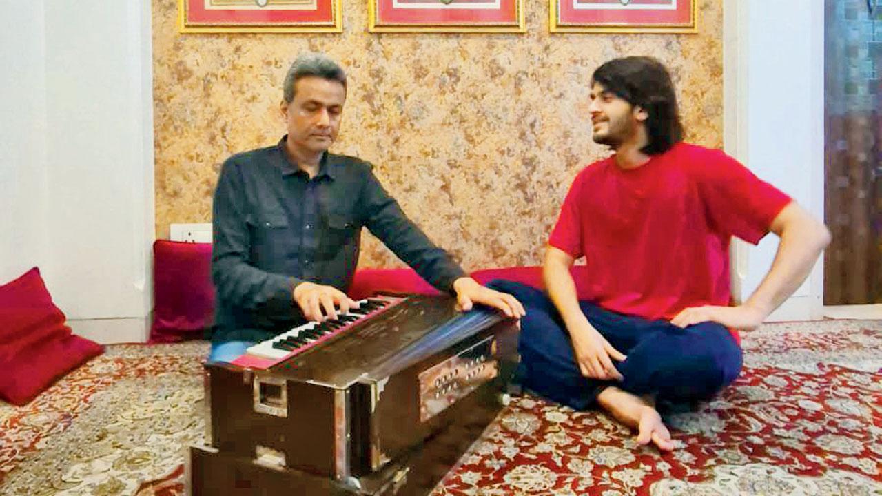 Qadir Mustafa Khan instructs a student at the academy 