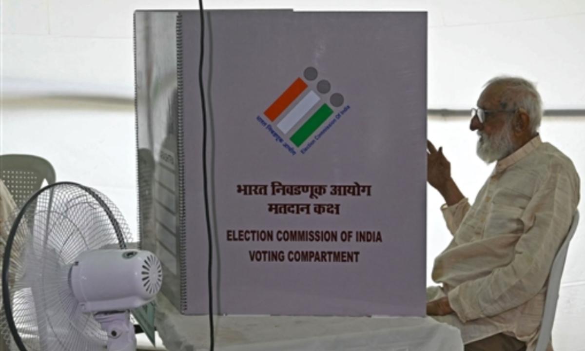 Veteran socialist and freedom fighter GG Parikh, who is 100 years old, casts his ballot at a polling place in Mumbai on May 20, 2024, during the fifth phase of the country's India general elections 2024.