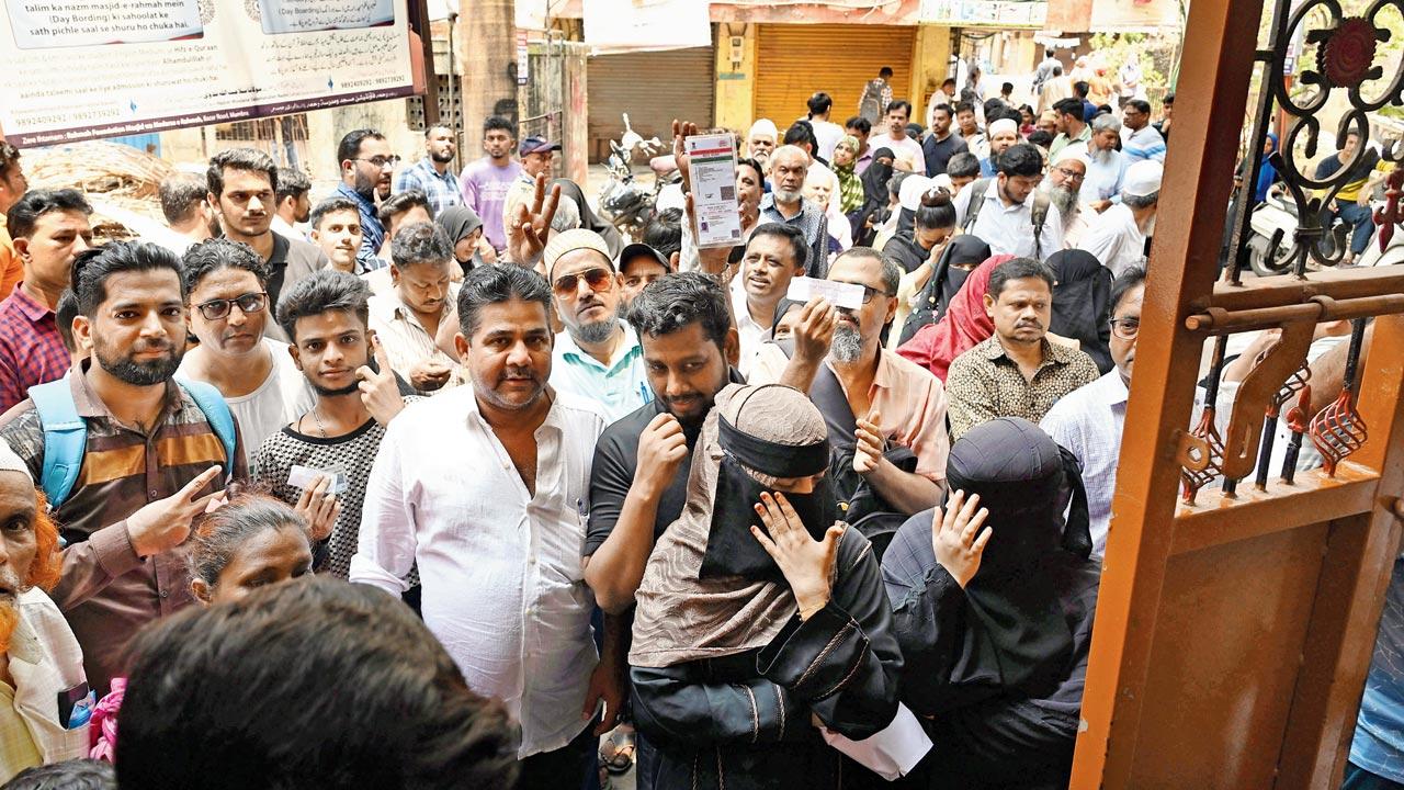 Local residents gathered in large numbers at St John’s Convent High School polling booth in Mumbra. Pic/Satej Shinde